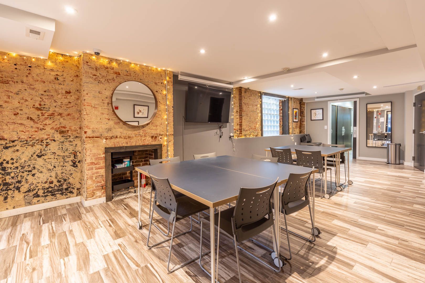 Private office with patterned accent wall and meeting table