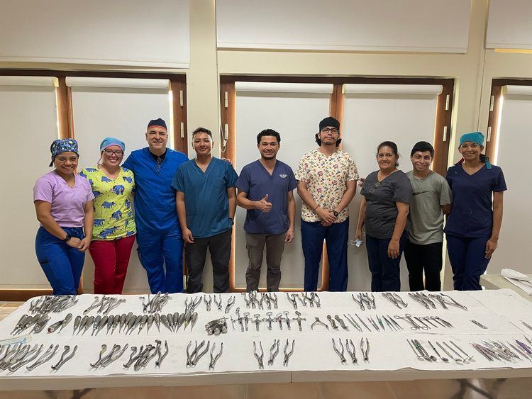 A group of doctors and nurses posing for a picture