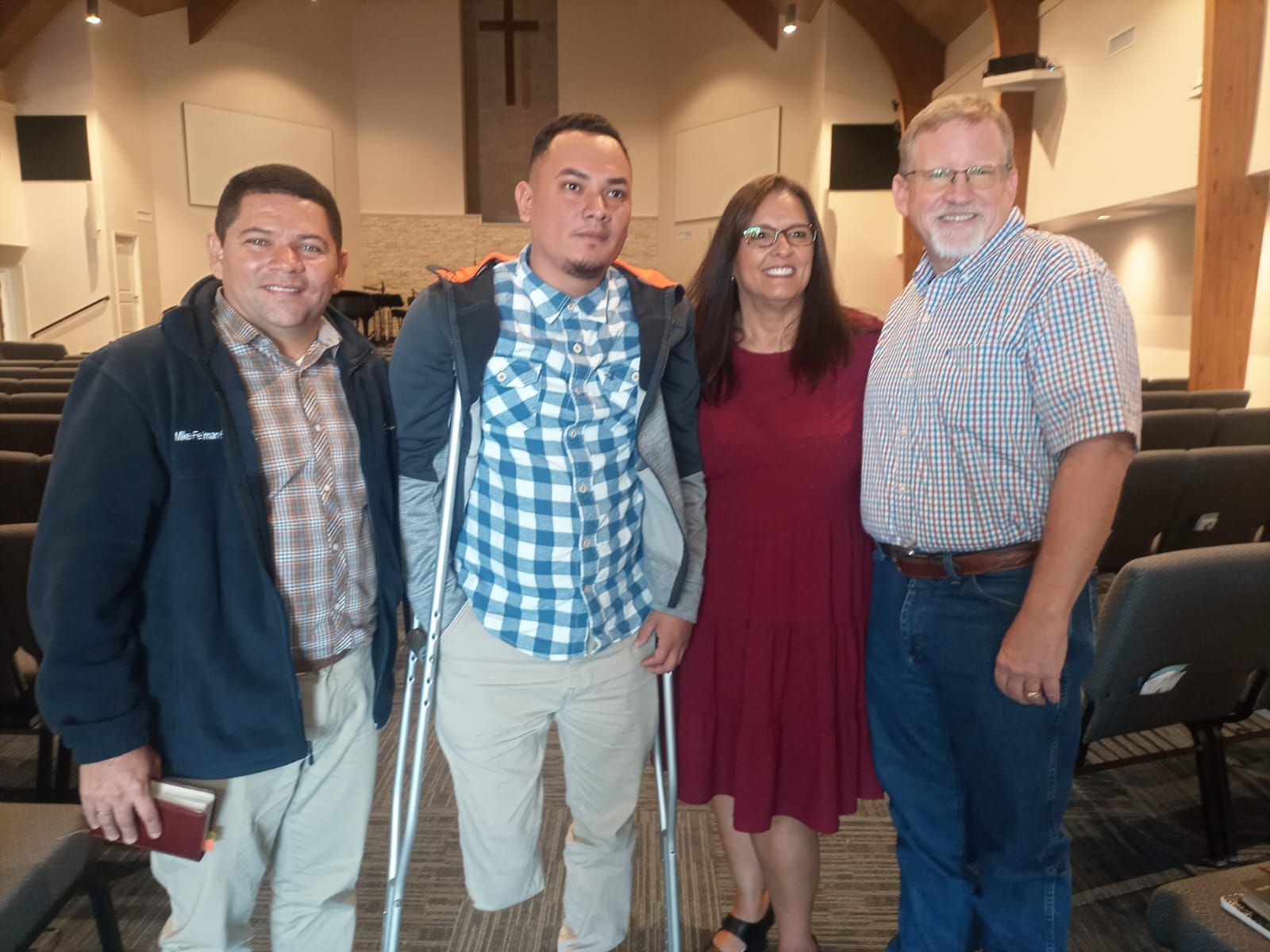 A group of people posing for a picture in a church