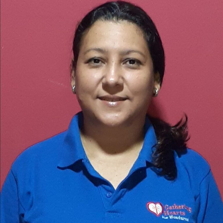A woman wearing a blue shirt that says catherine hearts