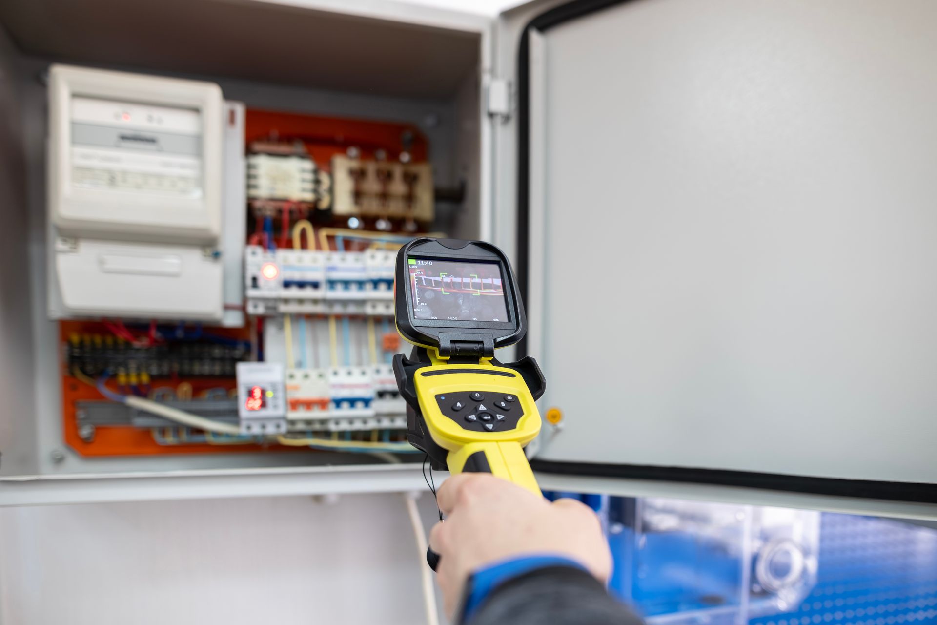 Electrical inspection of an open electrical panel using a thermal imaging camera.