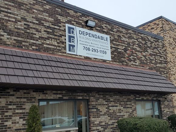A brick building with a sign on the side that says dependable