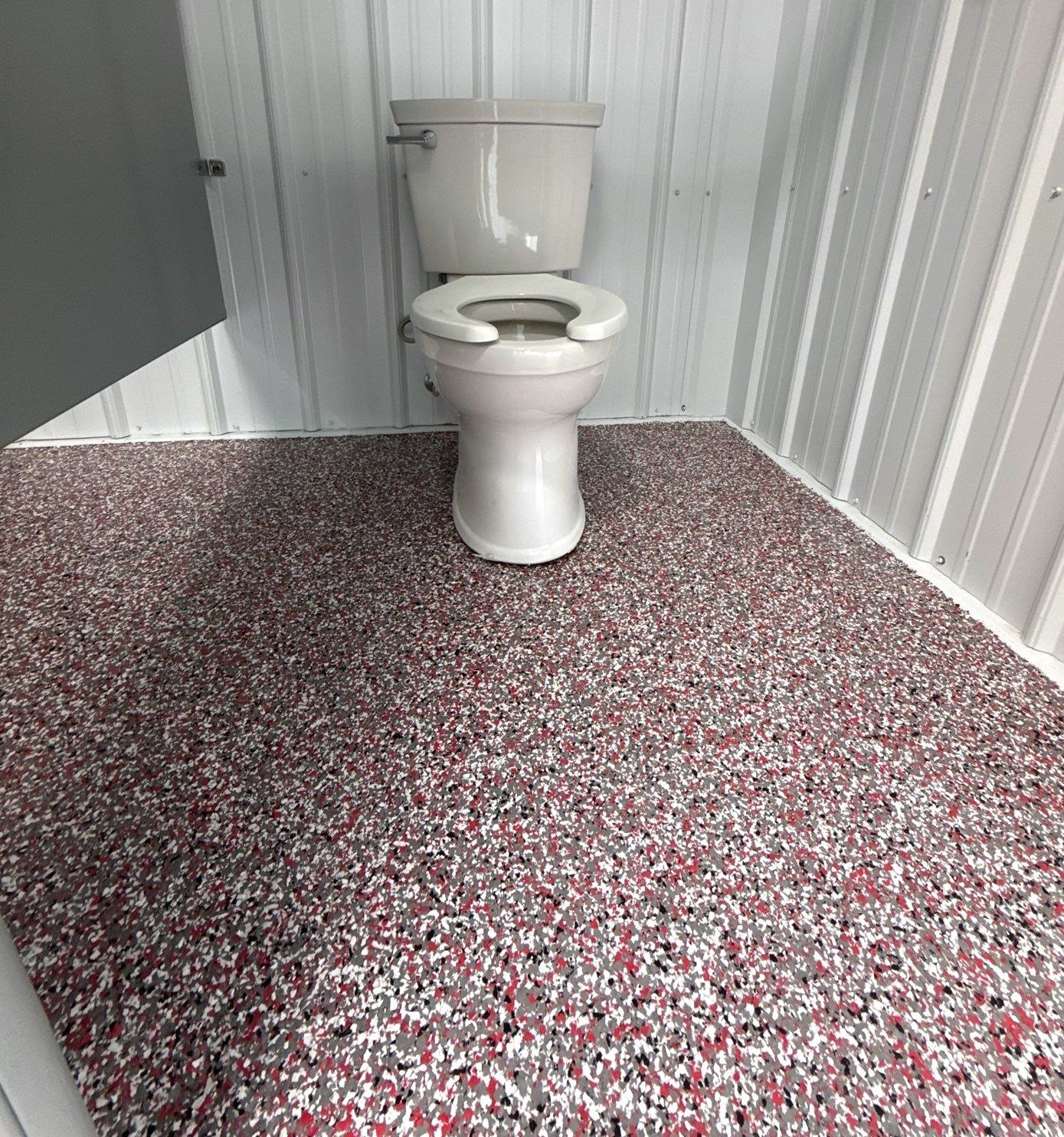 Interior of camp bathhouse with full-flake epoxy floor