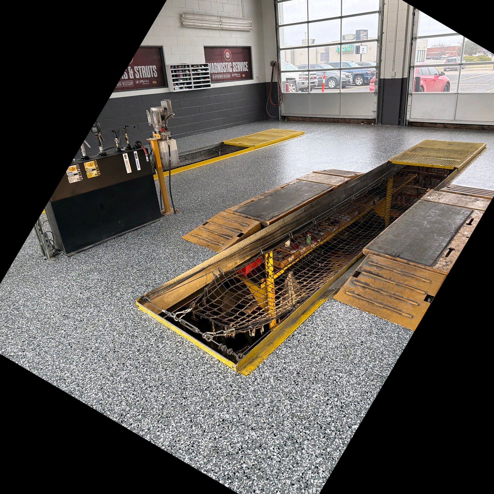 Automobile service bay with full-flake epoxy floor