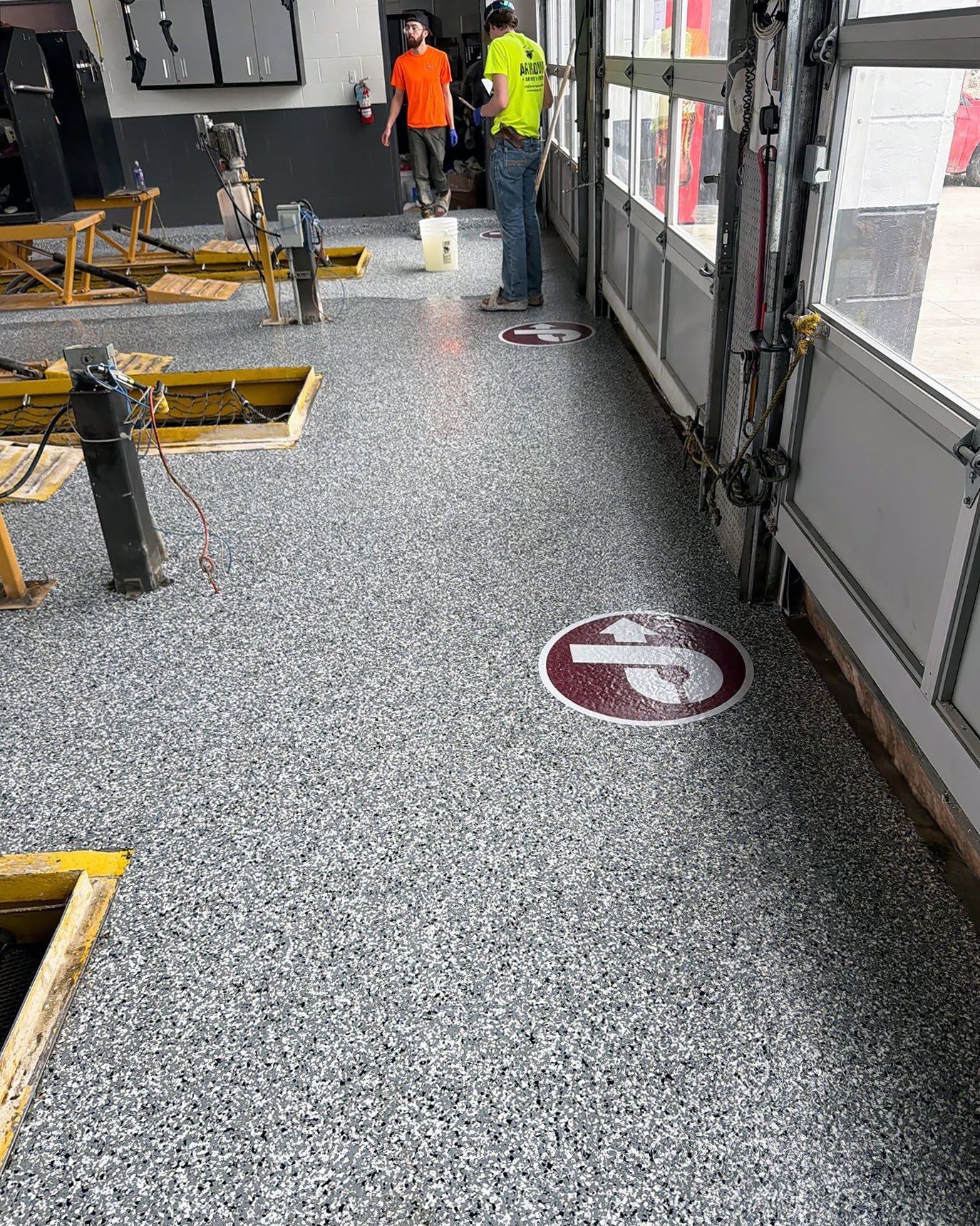 Automobile service bay with full-flake epoxy floor