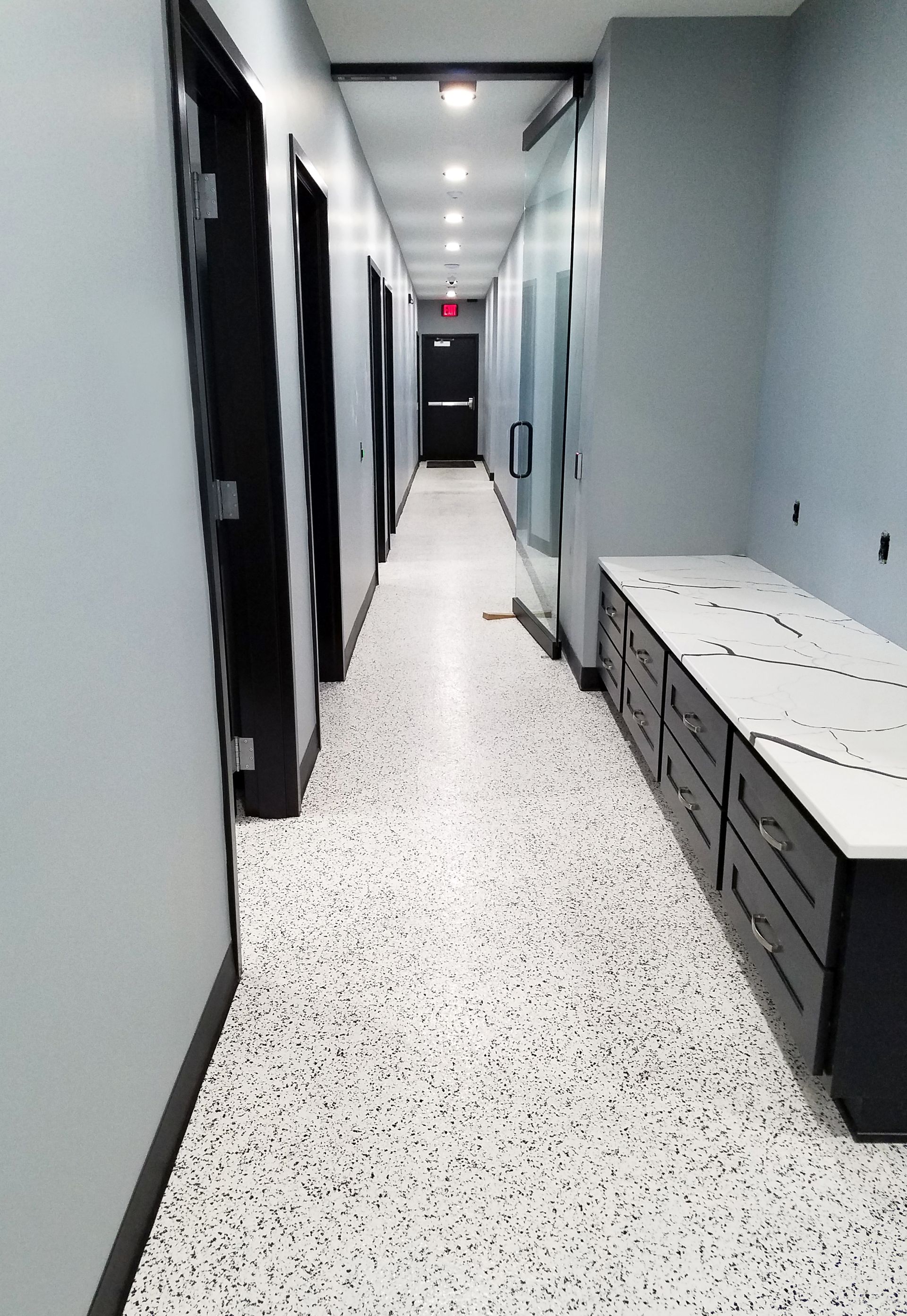 Office interior with custom full-flake epoxy floor and polyaspartic topcoat