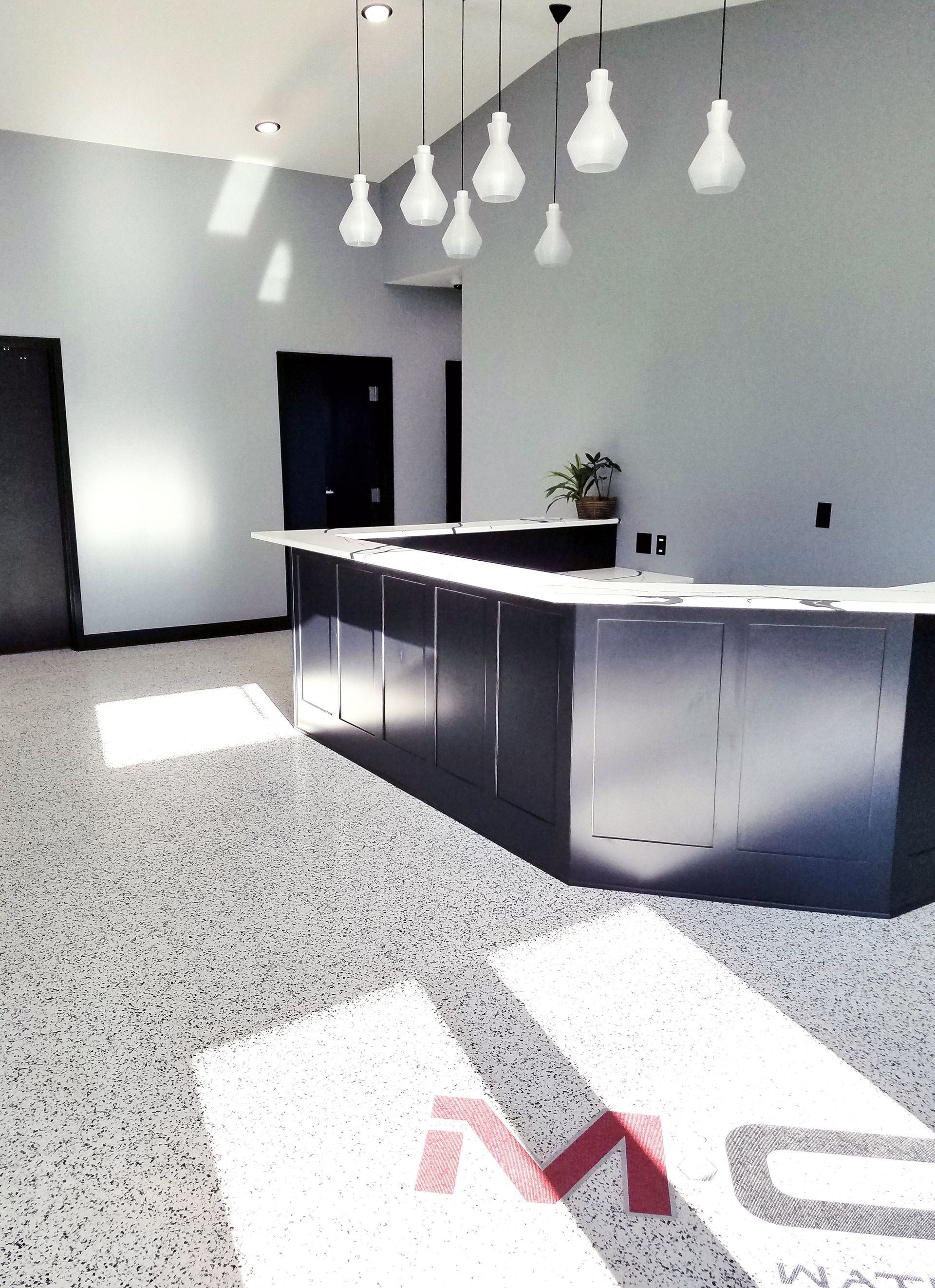 Office interior with custom full-flake epoxy floor and polyaspartic topcoat