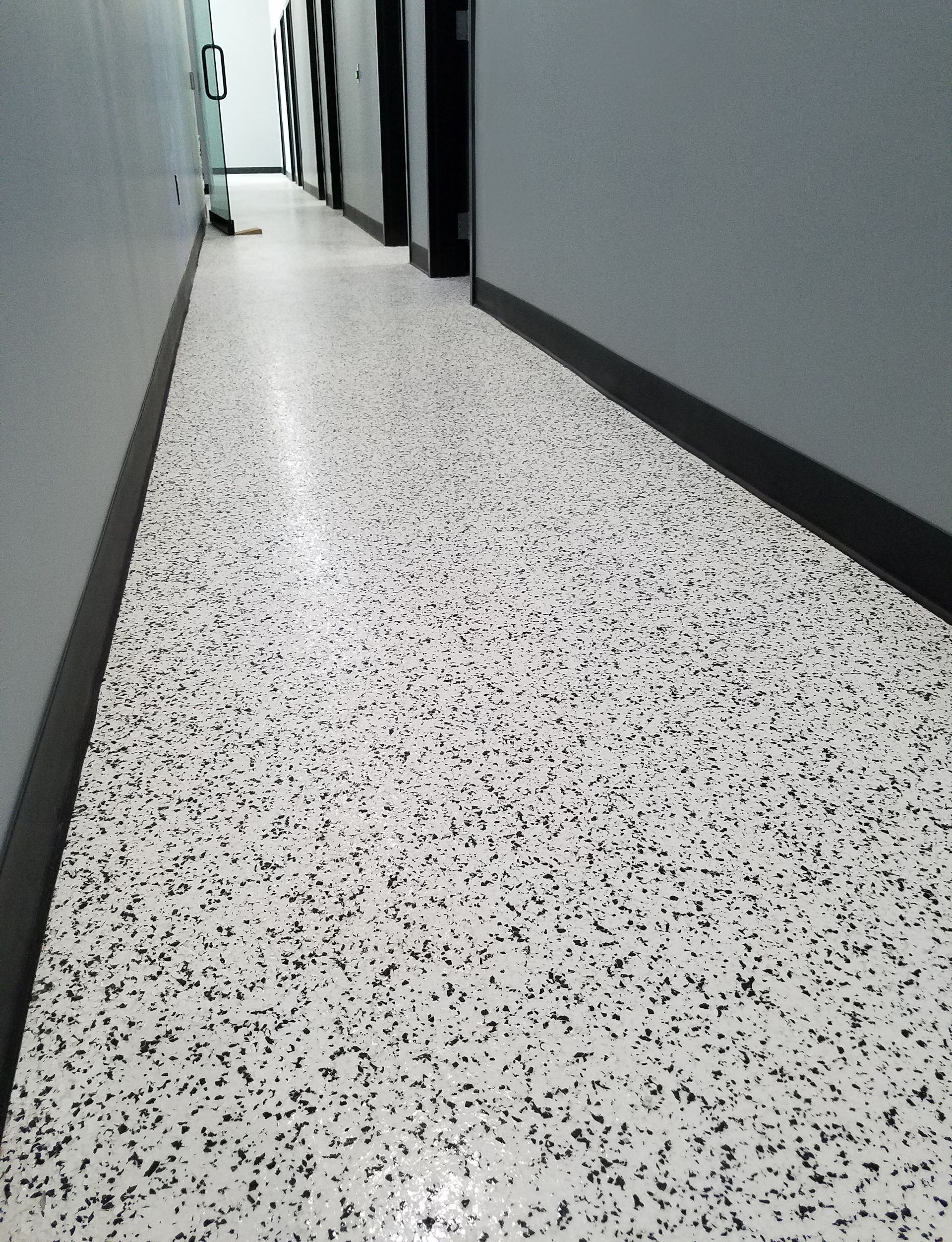Office interior with custom full-flake epoxy floor and polyaspartic topcoat