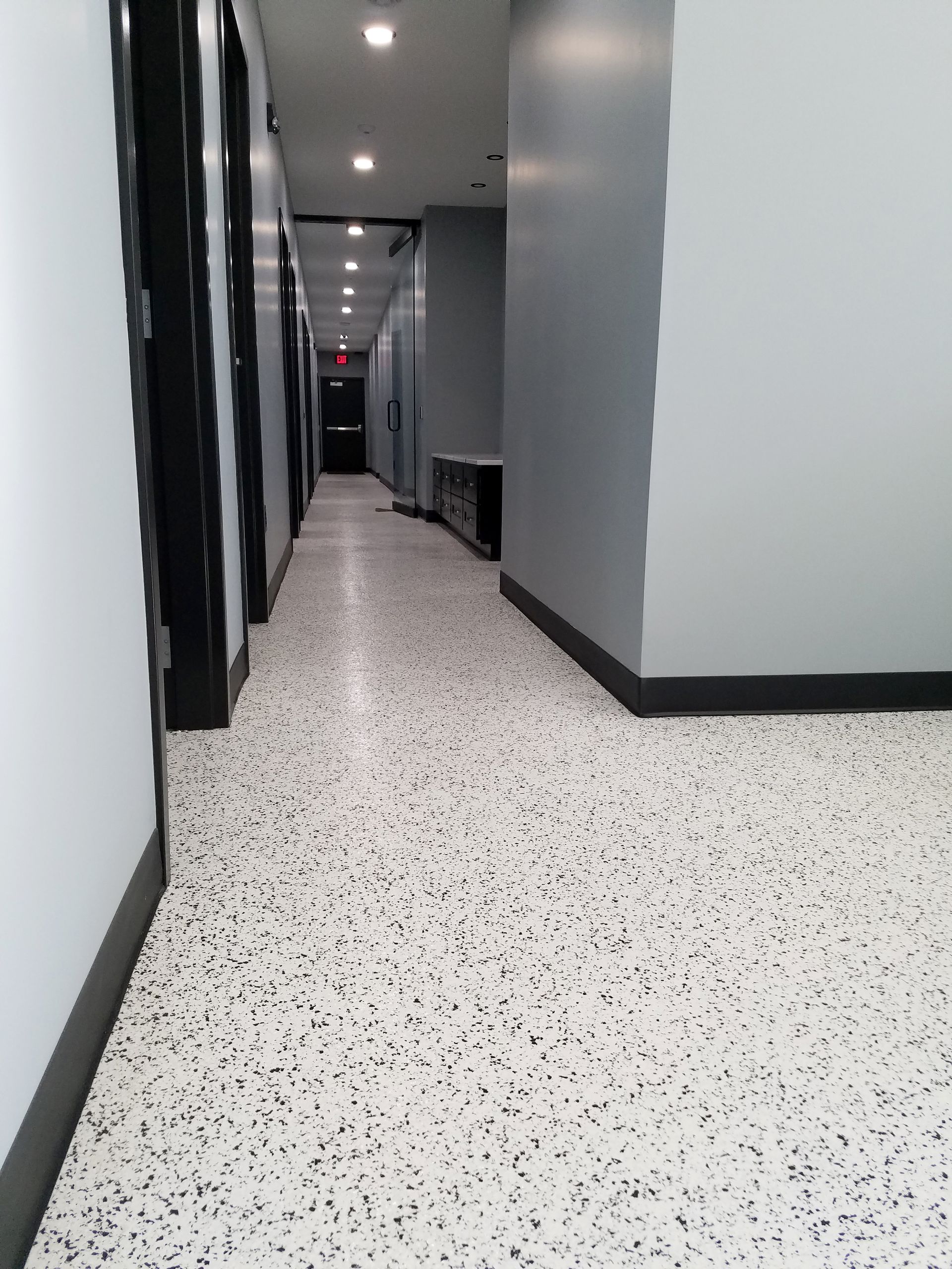 Office interior with custom full-flake epoxy floor and polyaspartic topcoat