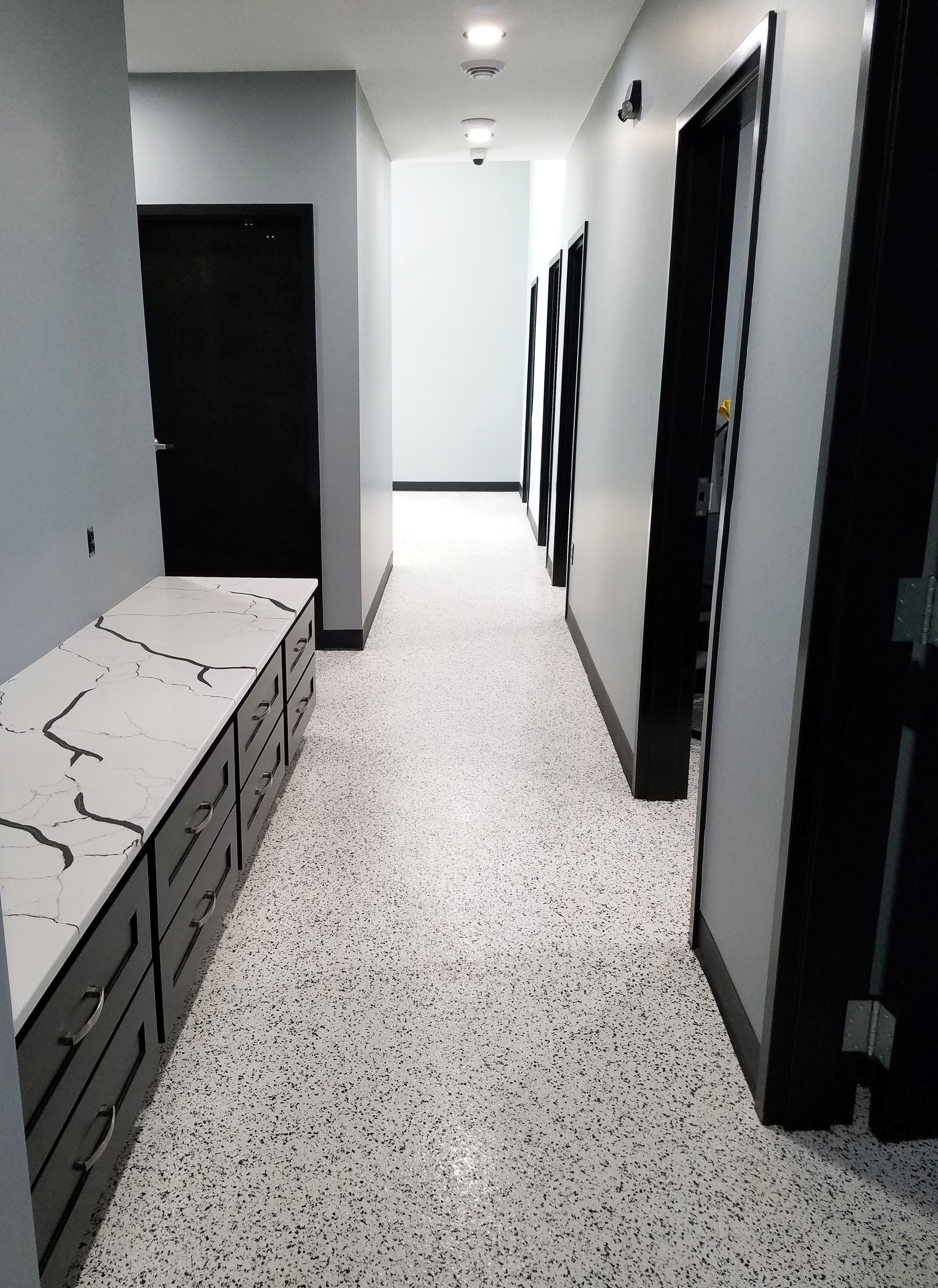 Office interior with custom full-flake epoxy floor and polyaspartic topcoat