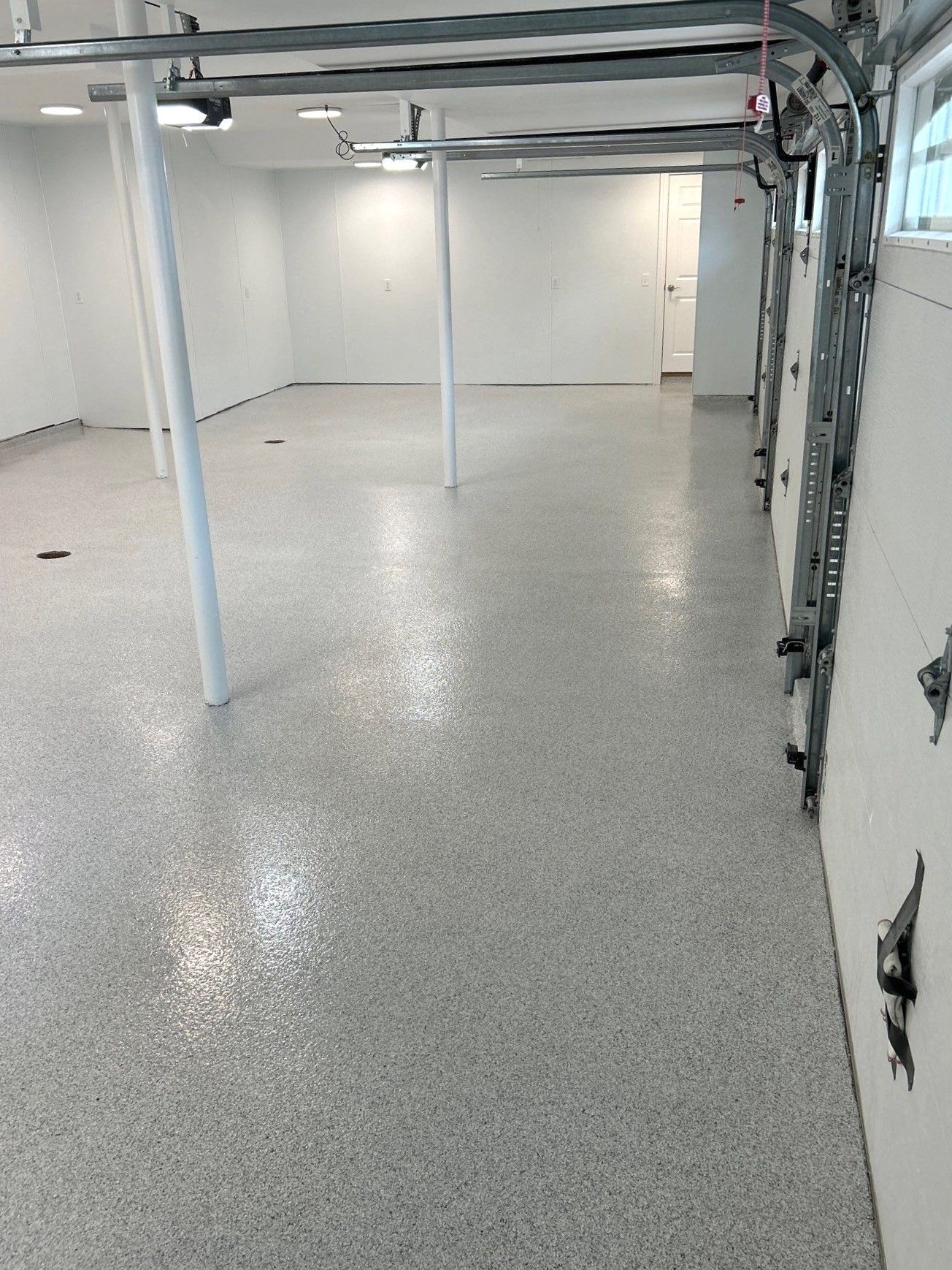 Home garage interior with full-flake epoxy floor