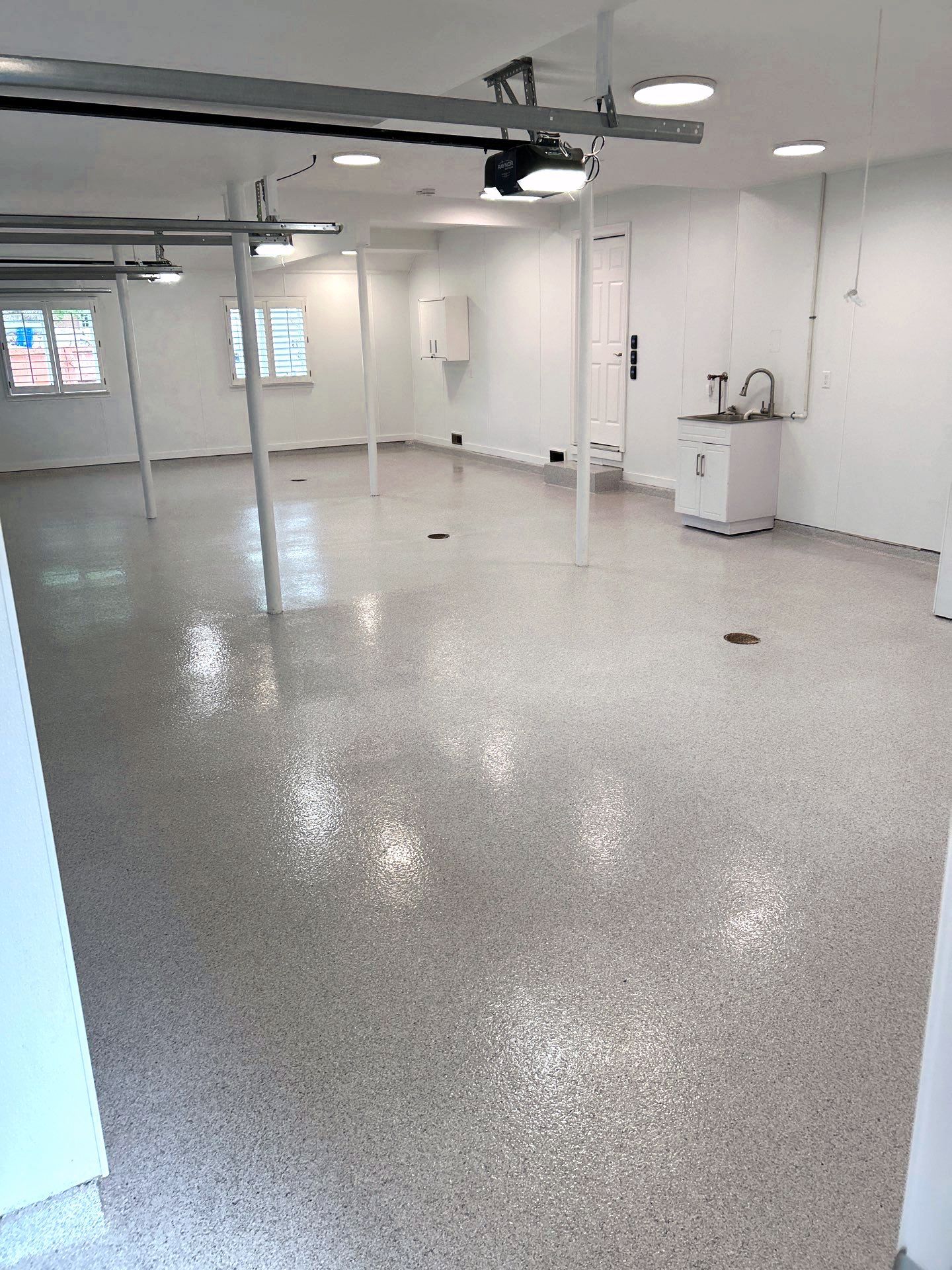 Home garage interior with full-flake epoxy floor