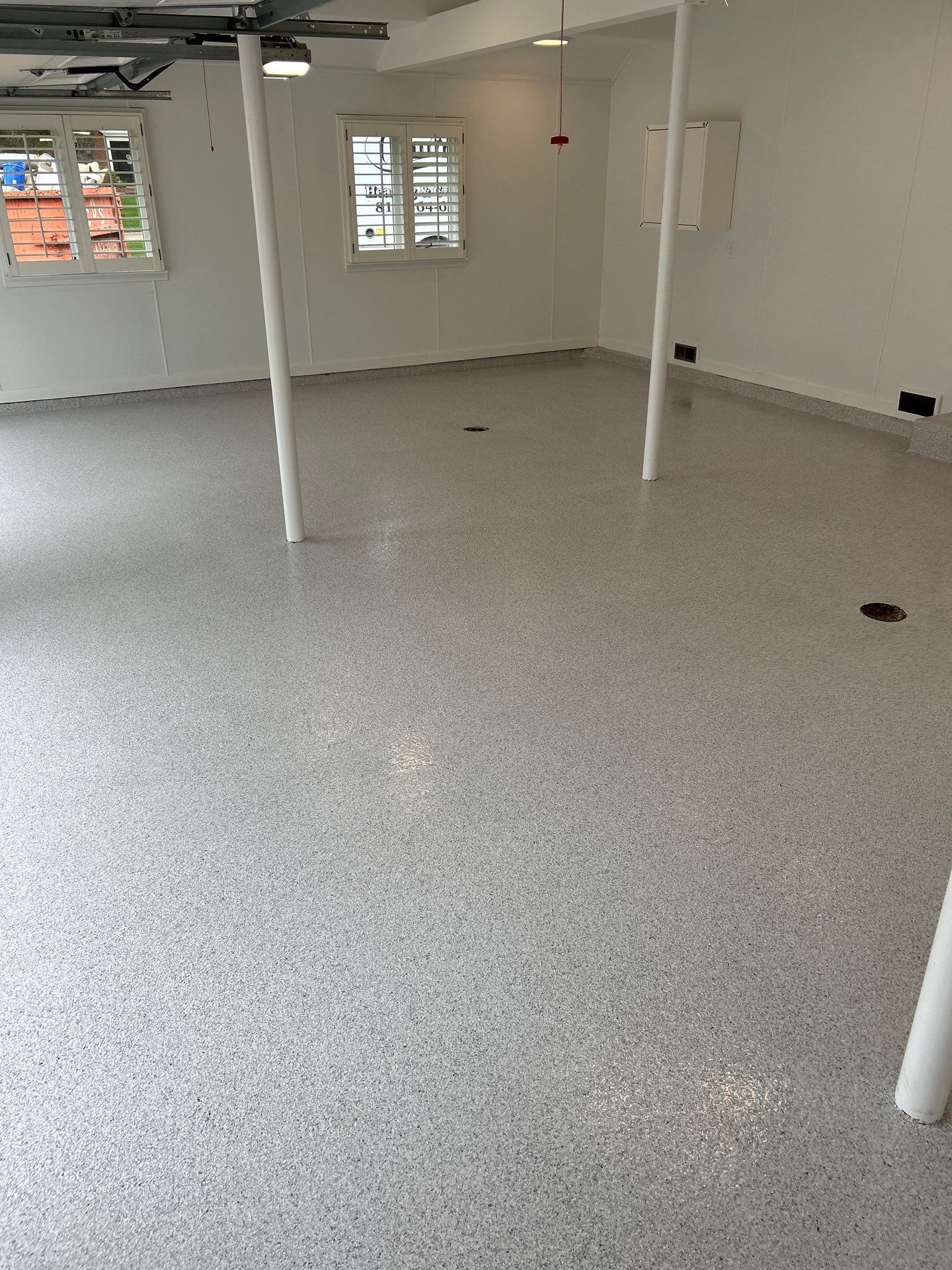 Home garage interior with full-flake epoxy floor