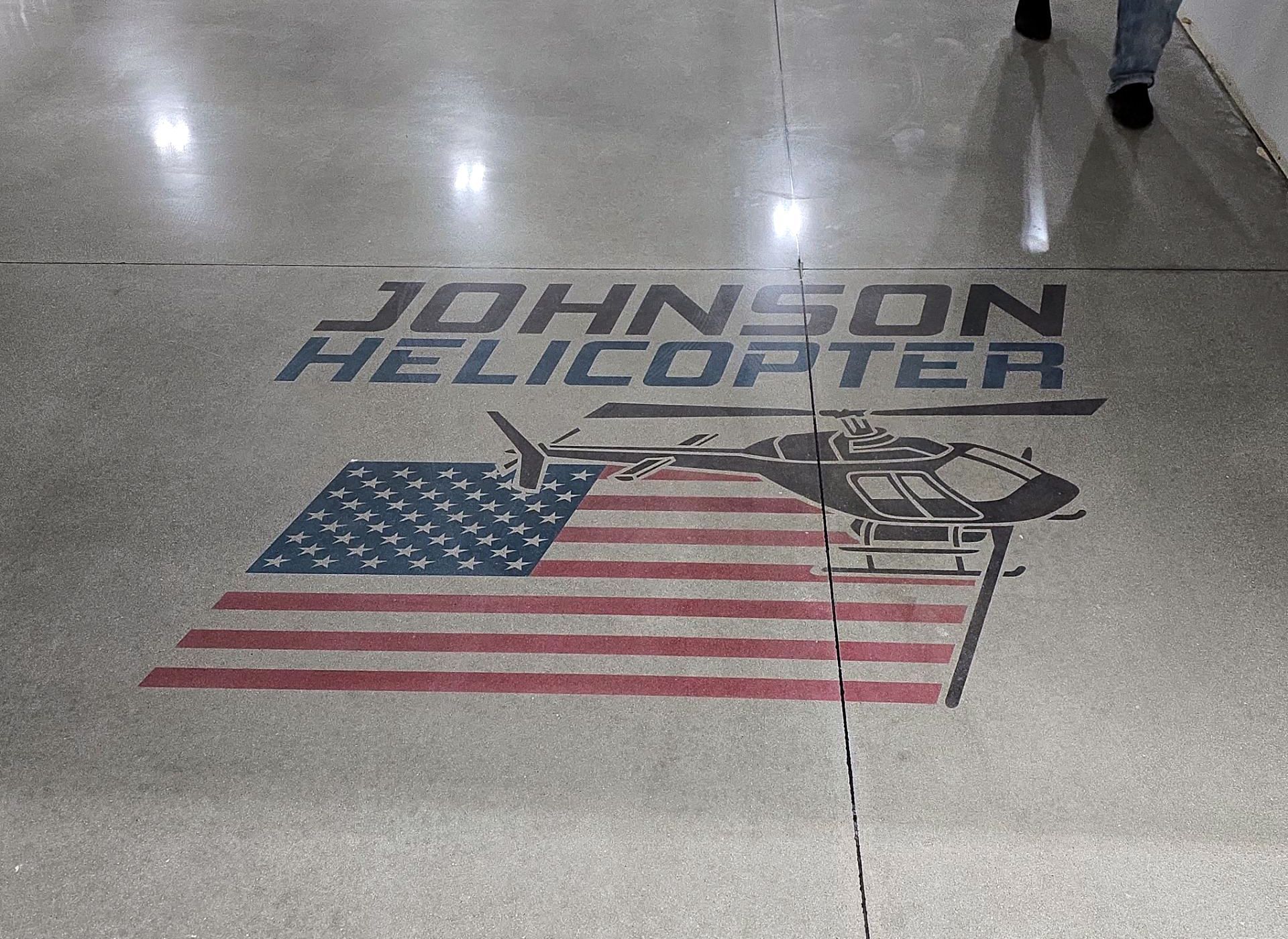 Aviation building interior with polished concrete floor and inset graphic
