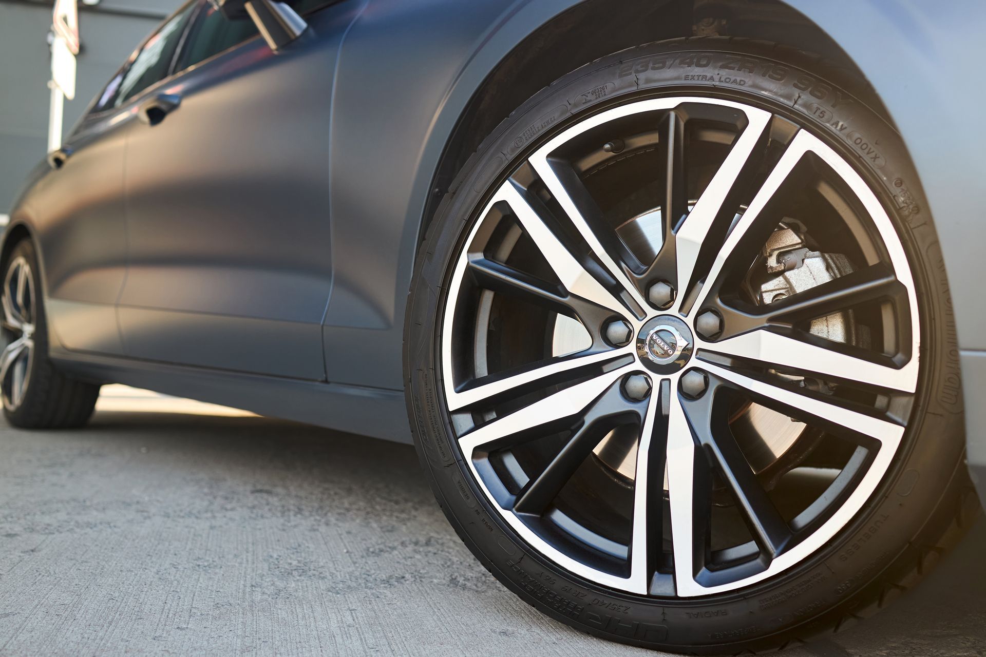 A close up of a car wheel with a tire on it.