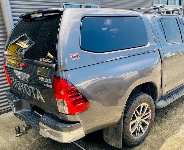 A Toyota Hilux Truck Is Parked In Front Of A Building — Tech Tune Automotive and 4x4 ARB In Innisfail, QLD