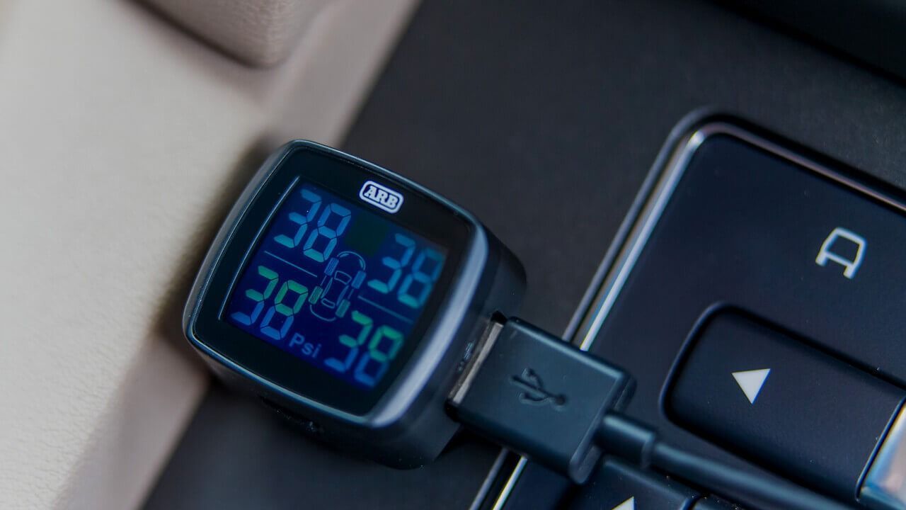 A Car Tire Pressure Monitor Is Plugged Into A Laptop — Tech Tune Automotive and 4x4 ARB In Innisfail, QLD