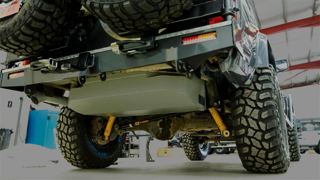 A Jeep With A Large Tank Underneath It Is Parked In A Garage — Tech Tune Automotive and 4x4 ARB In Innisfail, QLD