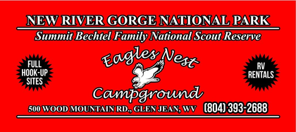 Eagles Nest Campground sign at New River Gorge National Park with reservations, sites, and phone number on red background