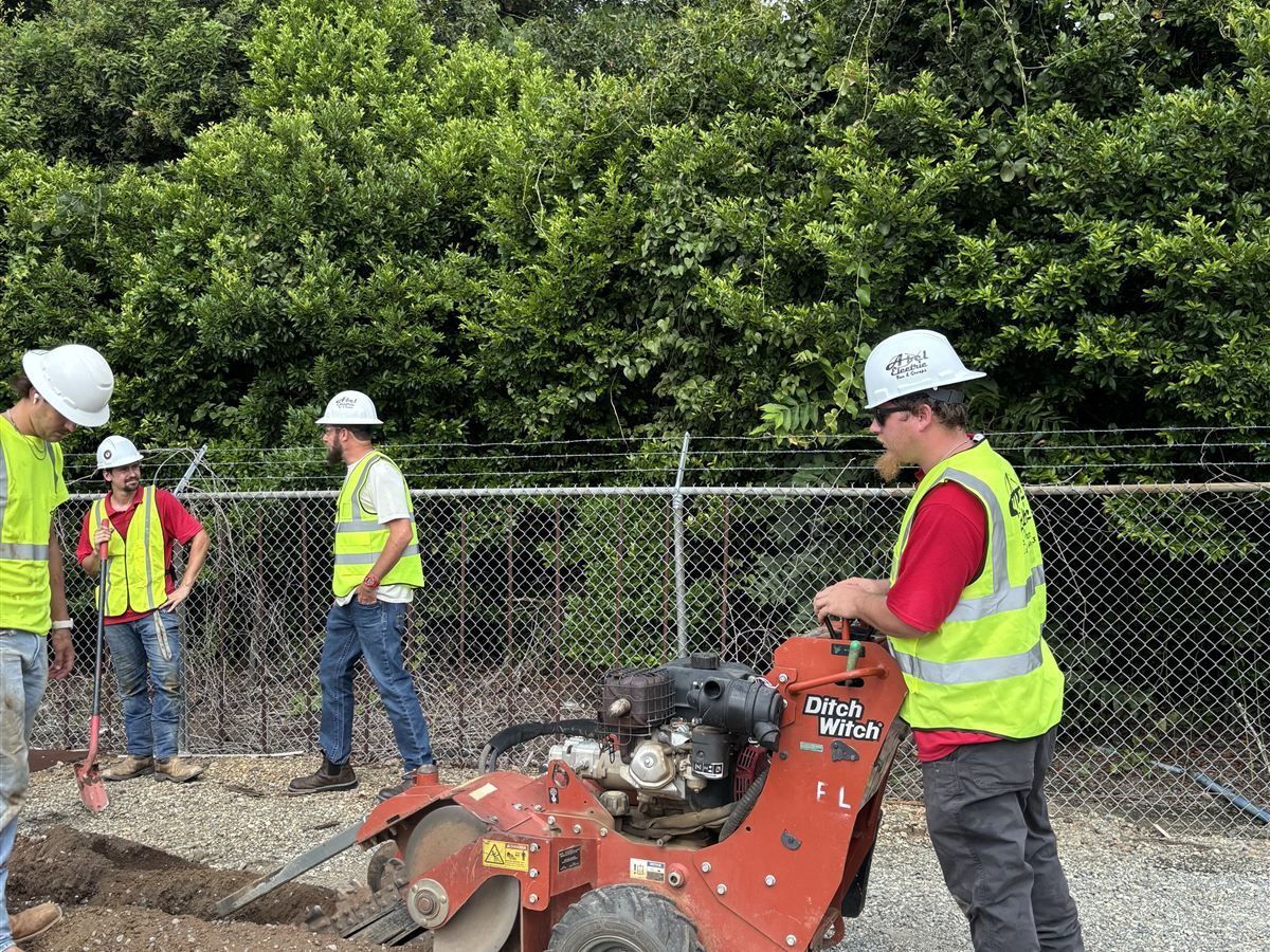 Abel Electric crew trenching for underground electrical work at the train station in Phenix City AL