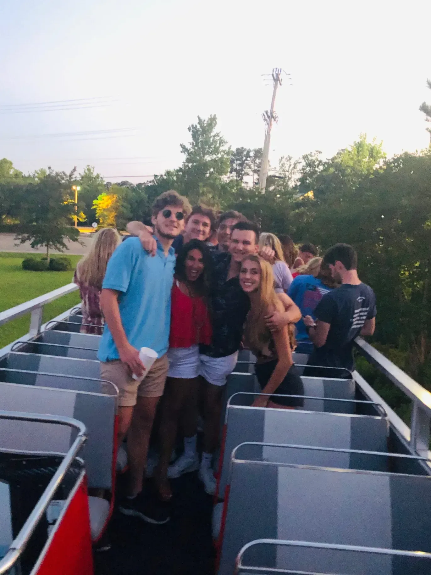 A group of people are posing for a picture on a boat