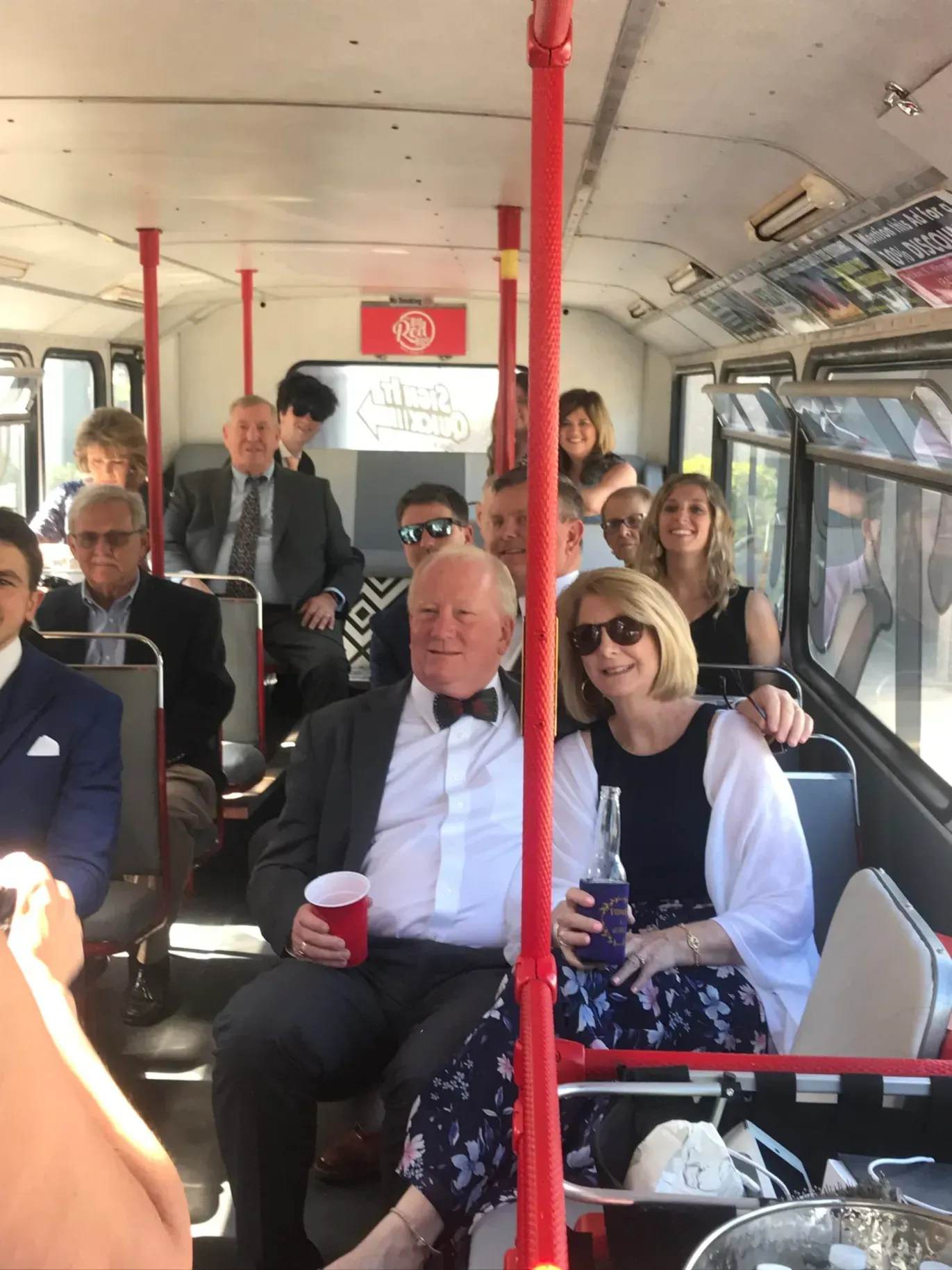 A group of people are sitting on a bus.