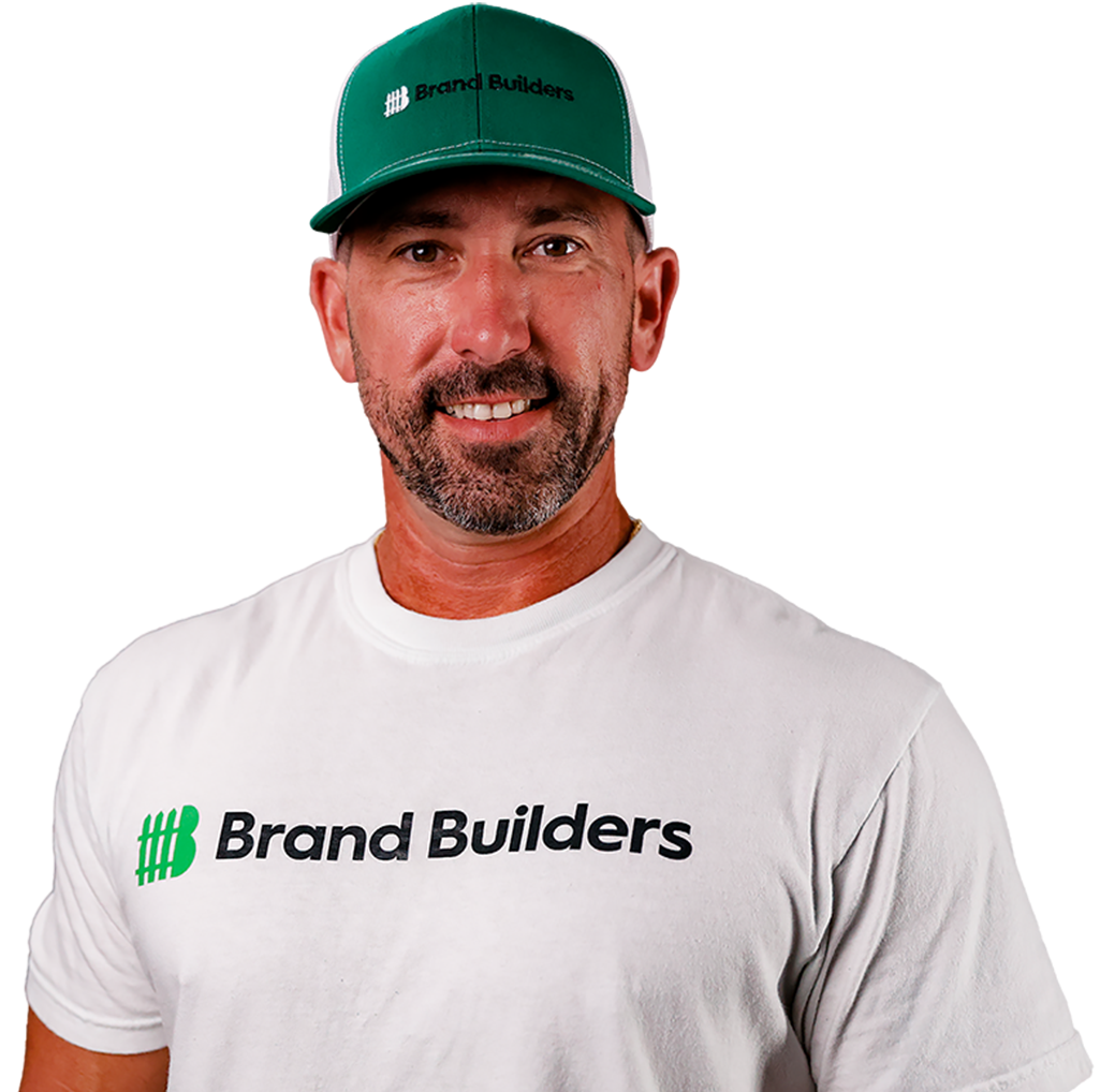 Man wearing a green cap and white Brand Builders T-shirt against a white background.