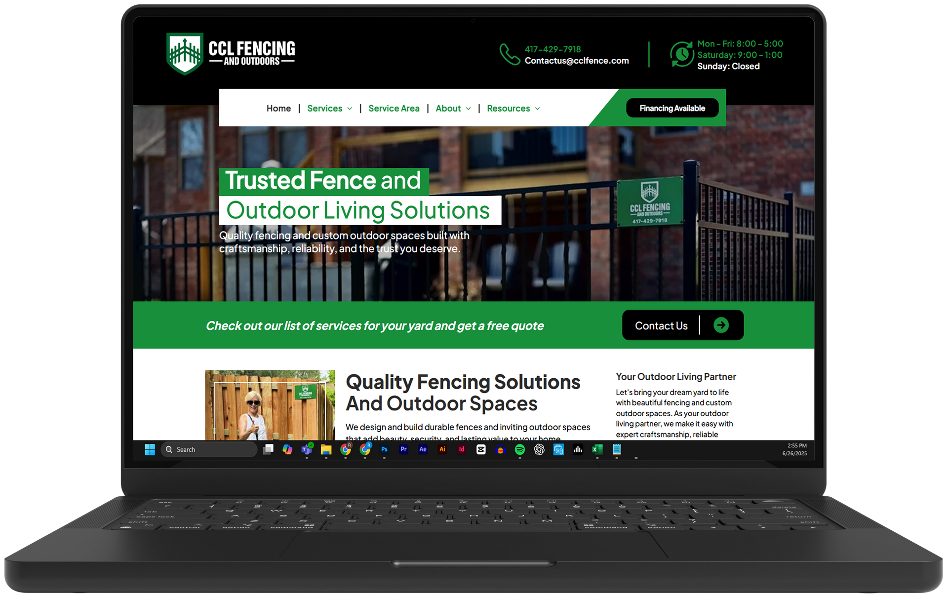 Laptop displaying a green-and-black fencing company website homepage with a residential fence hero image