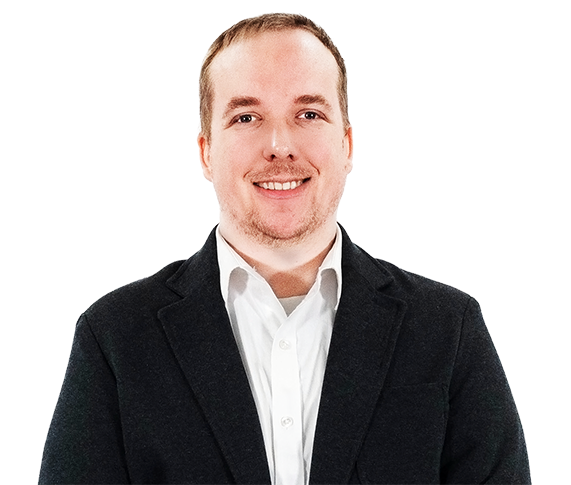 Smiling man in a black blazer and white shirt against a white background