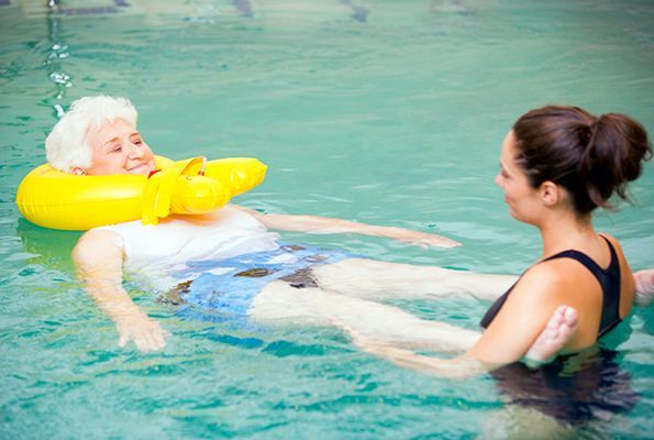 Group Of Children Are Getting Ready To Jump Into A Swimming Pool — Valentine Swim School in Croudace Bay, NSW