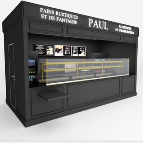 Kiosque de boulangerie noir "PAUL" présentant du pain et des viennoiseries.