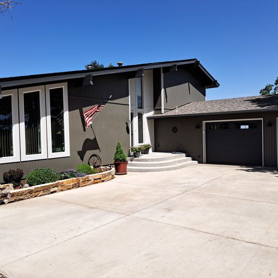 A house with a flag hanging from the side of it