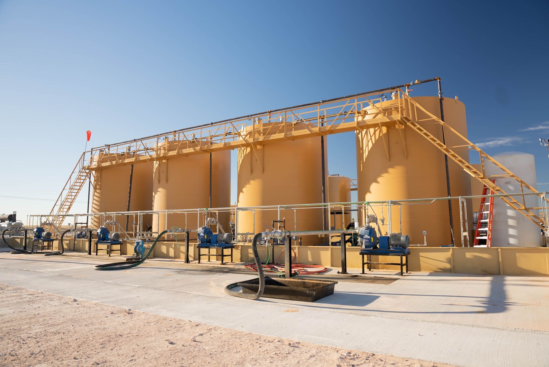 A large building with a lot of tanks and pumps