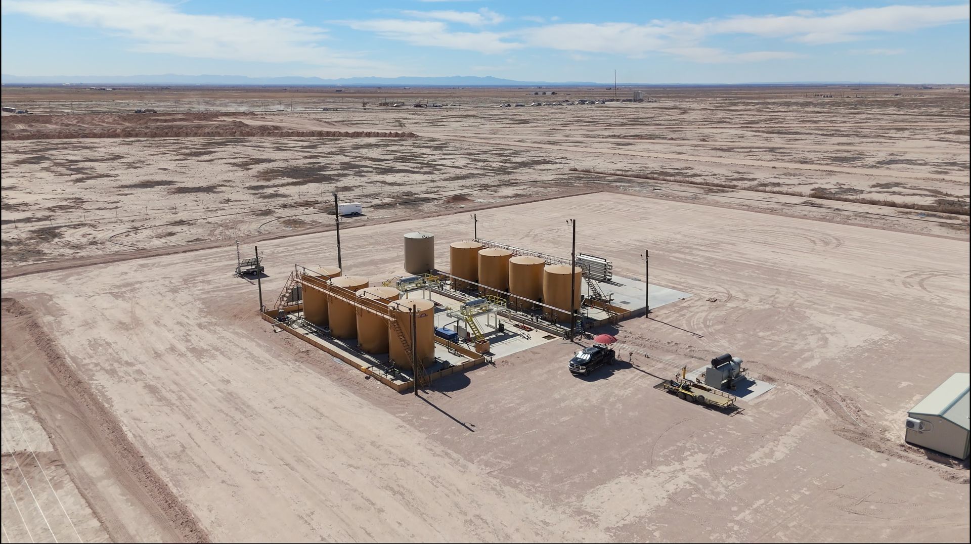 An aerial view of a building in the middle of a desert
