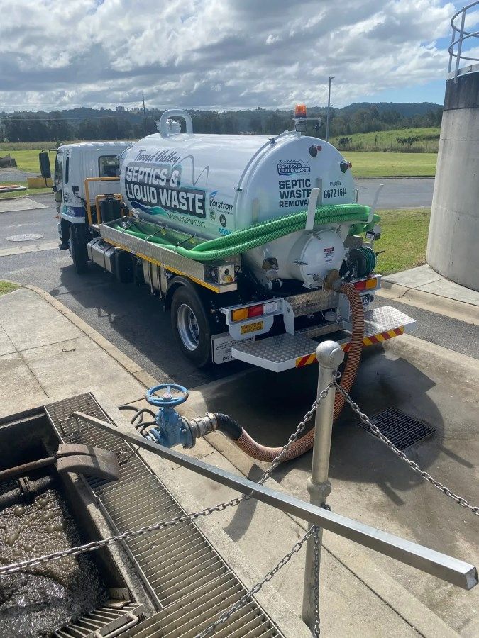 A Vacuum Truck Is Parked On The Side Of The Road — Tweed Valley Septics & Liquid Waste Management in Chillingham, NSW