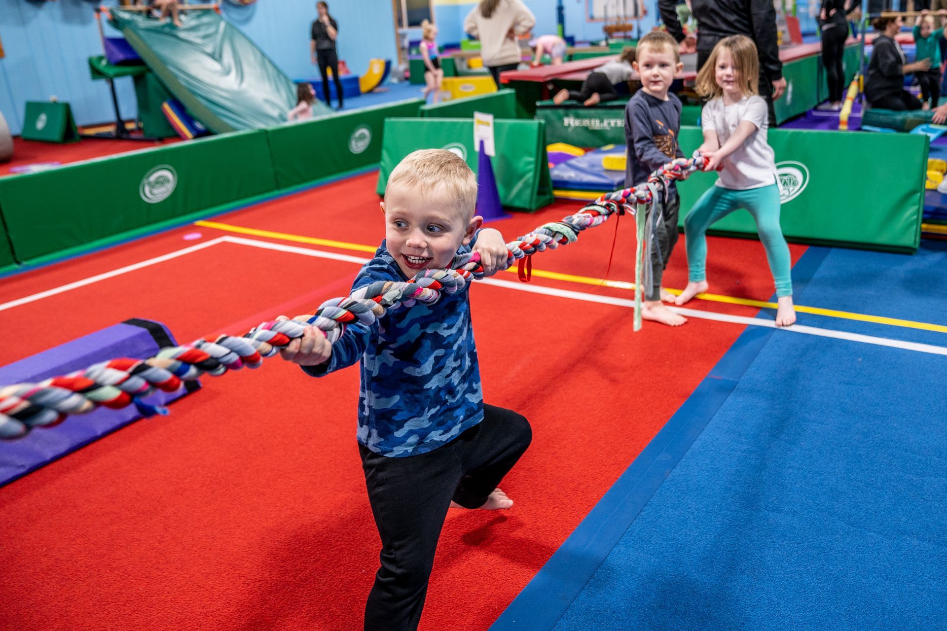 Young boy playing tug-a-war