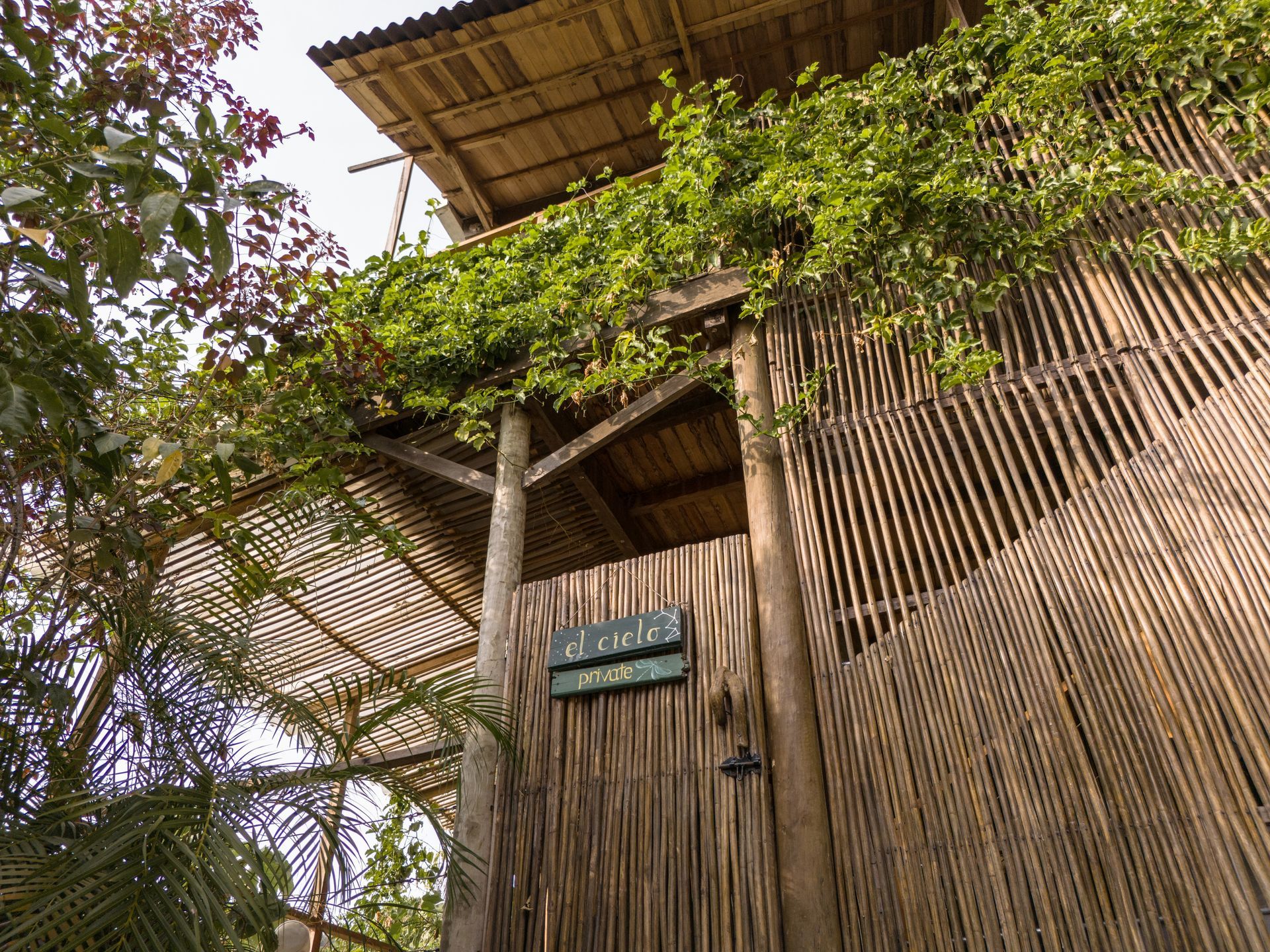 A wooden building with a sign that says ' acacia ' on it