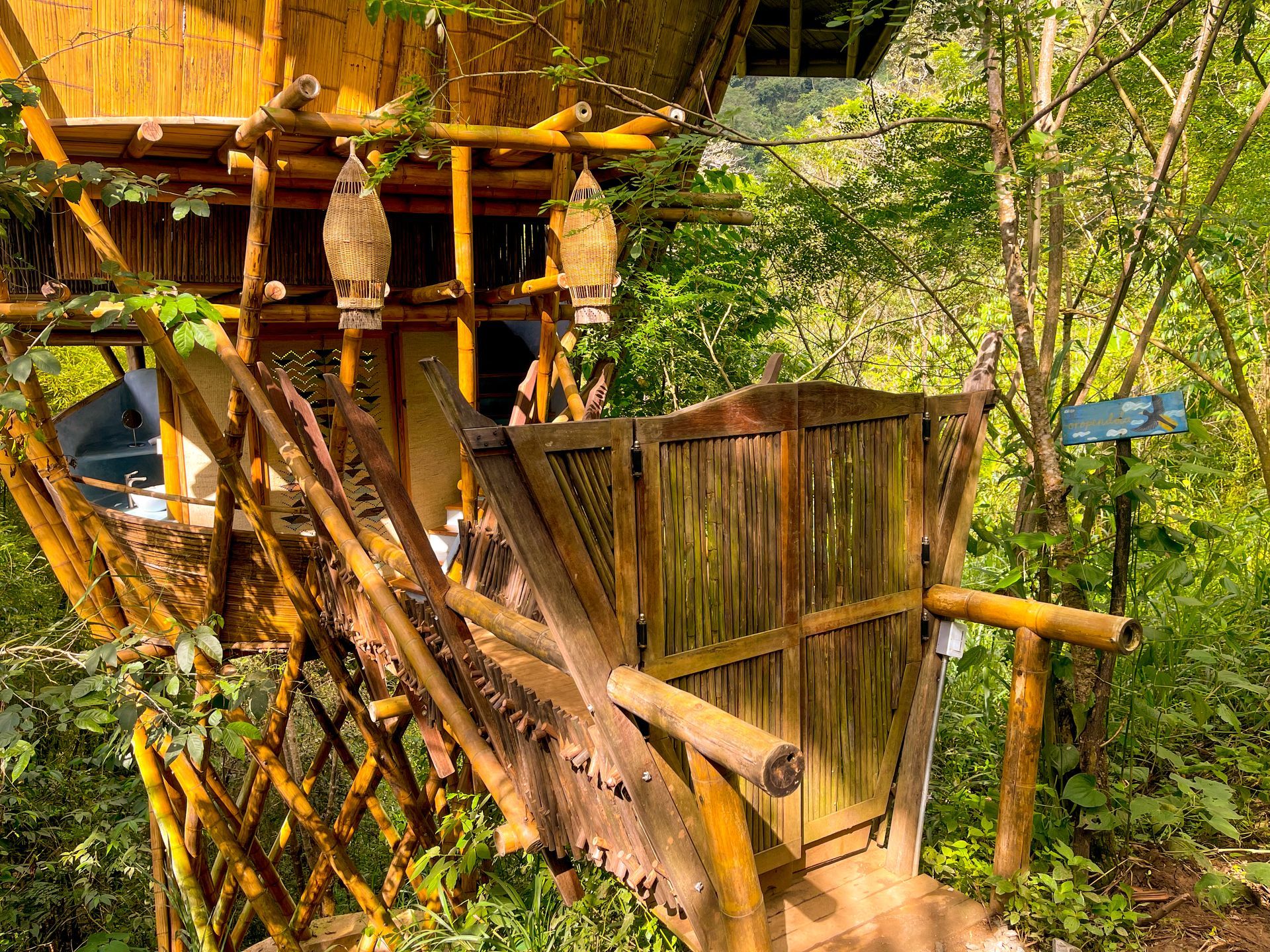 A wooden tree house in the middle of a forest
