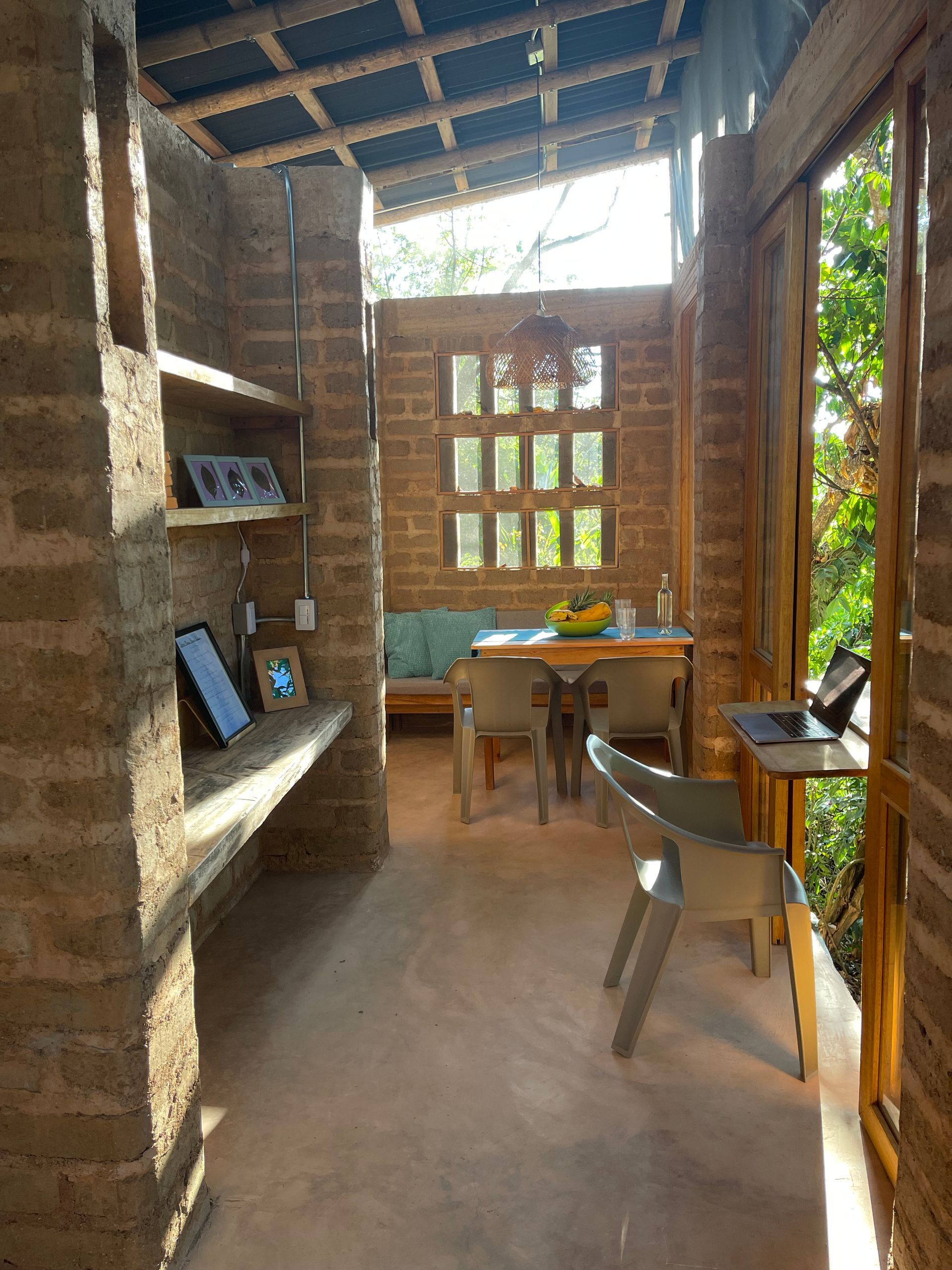 A room with a table and chairs in it