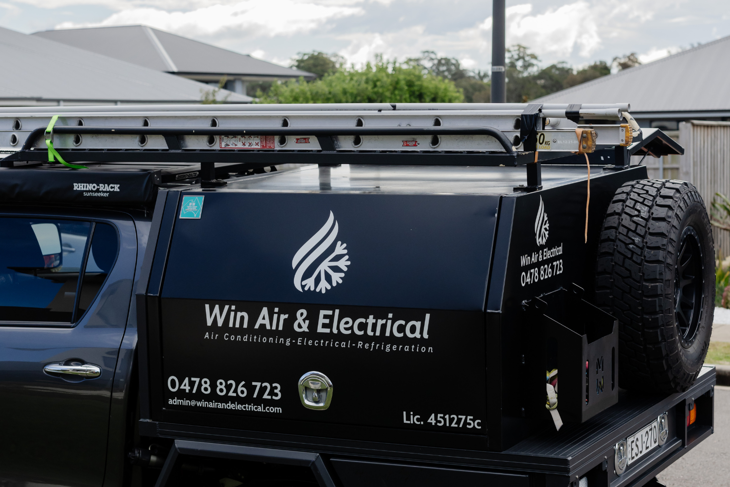 Image of Win Air & Electrical branded work ute.