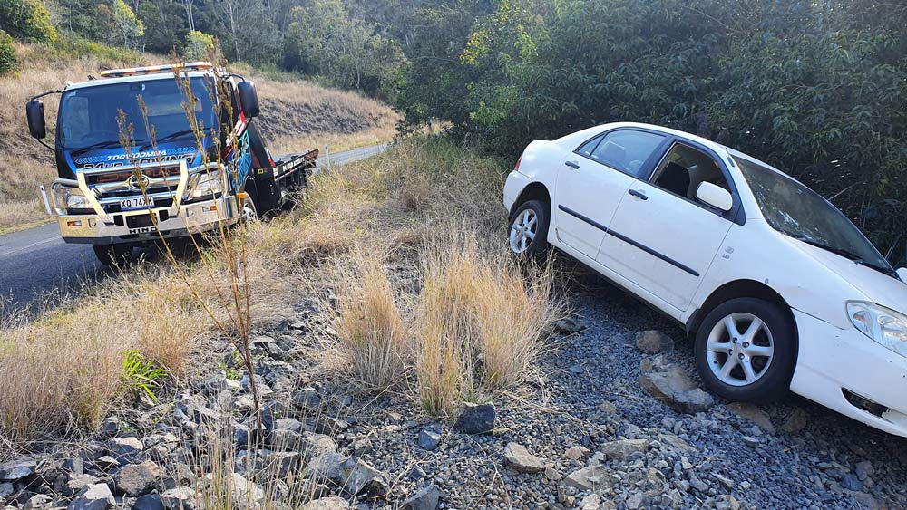 Towing The Broken White Car On The Side Of The Highway — Toowoomba 24hr Towing In Toowoomba, QLD