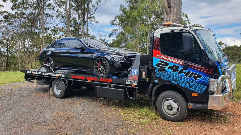 Towing  Truck Loaded with A Black Car — Toowoomba 24hr Towing In Toowoomba, QLD