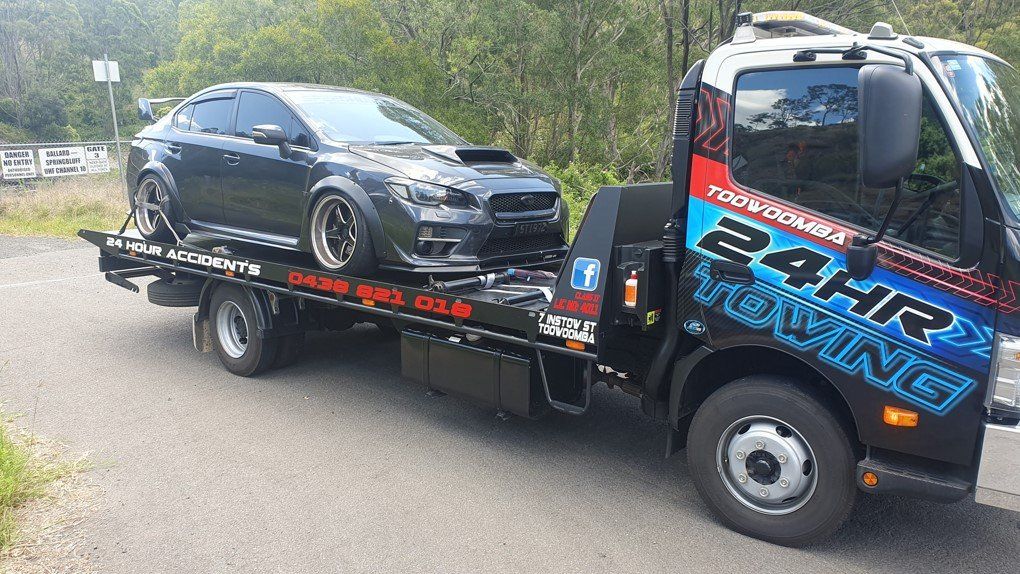 Towing A Black Car — Toowoomba 24hr Towing In Toowoomba, QLD