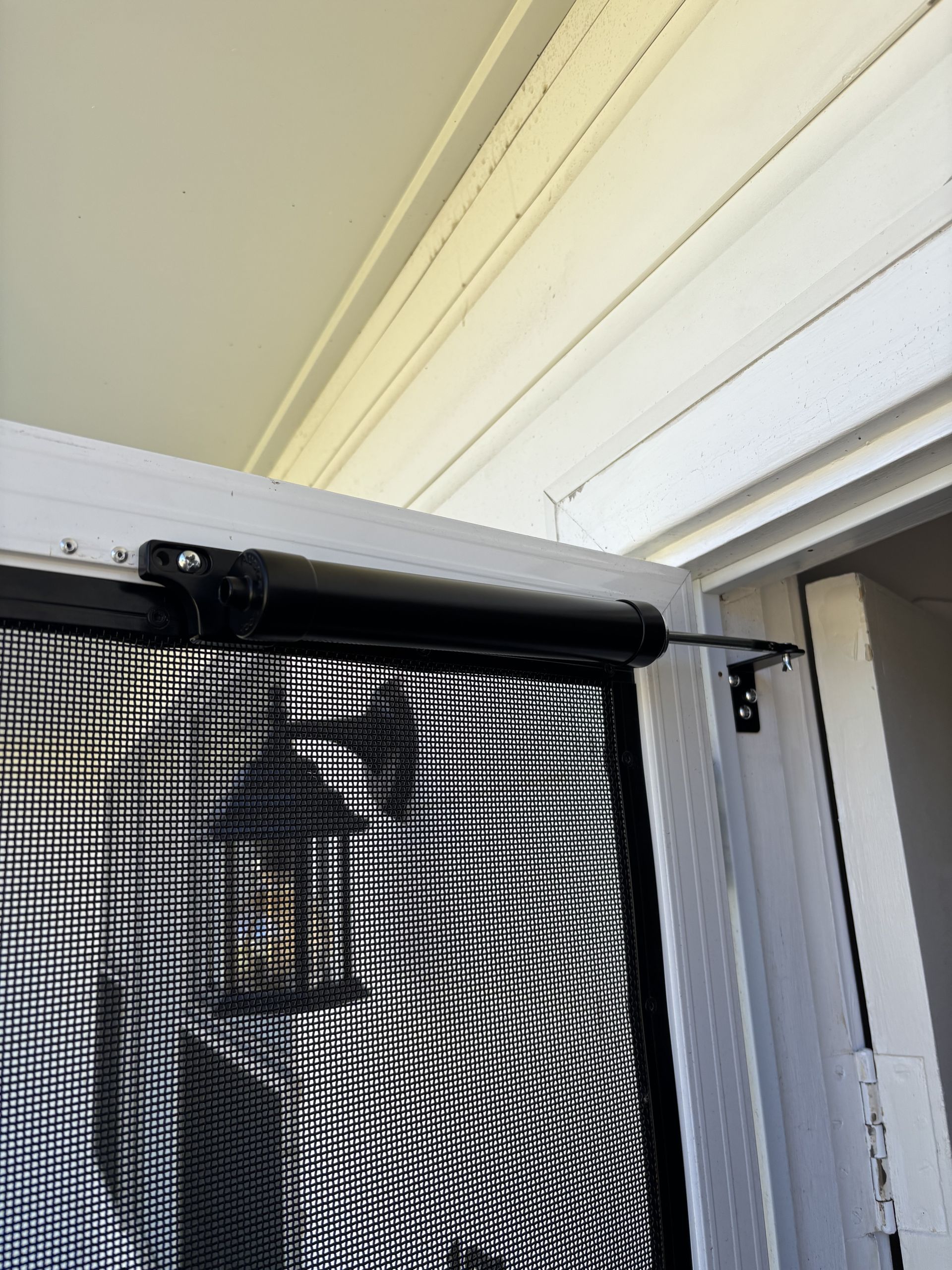 Screen Door With Black Closer Attached To White Door — Fix-A-Door in Cessnock, NSW
