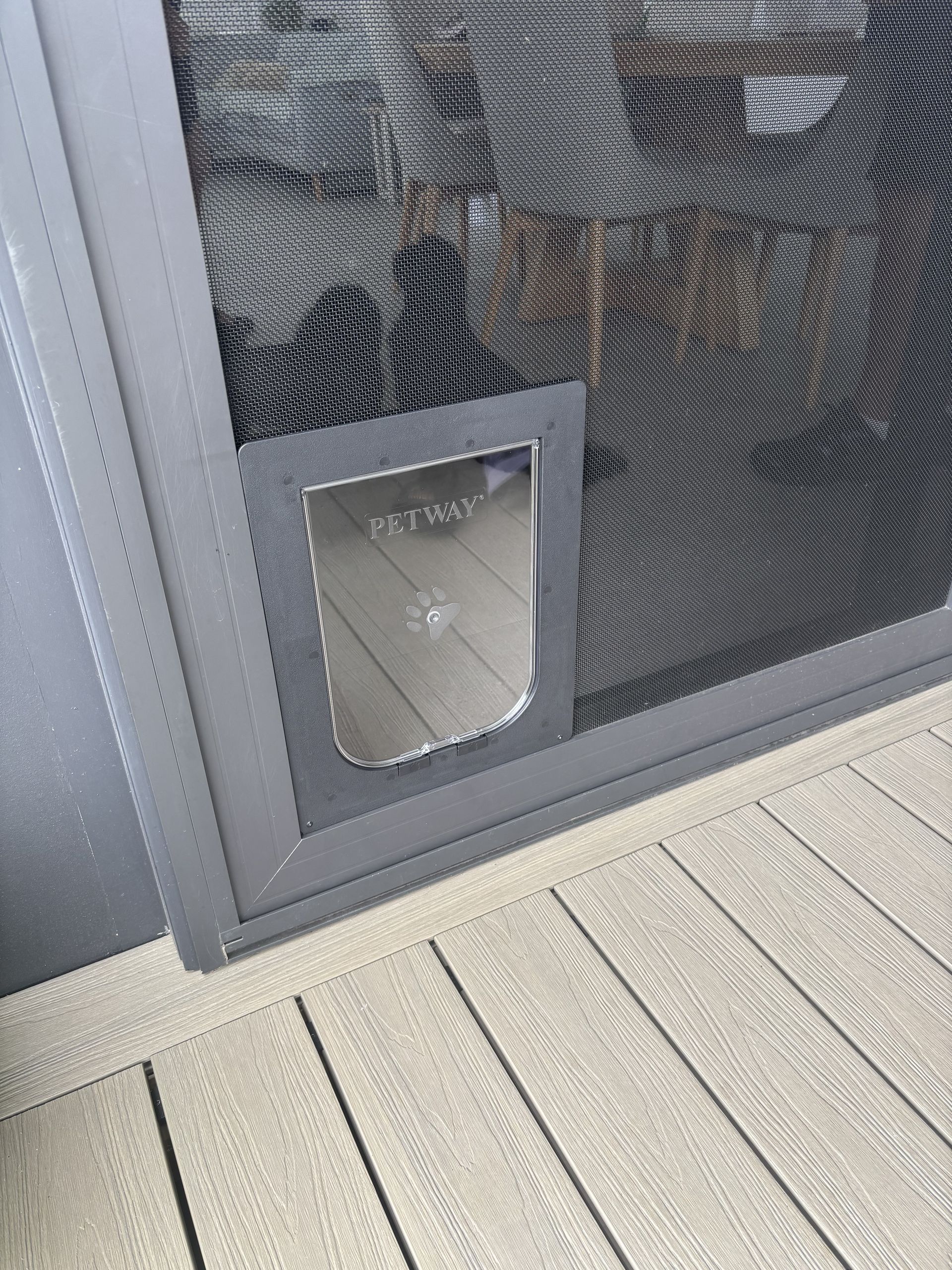 Screen door with a PetSafe cat door installed; grey frame, black mesh, brown mat -Fix-A-Door in Morisset, NSW