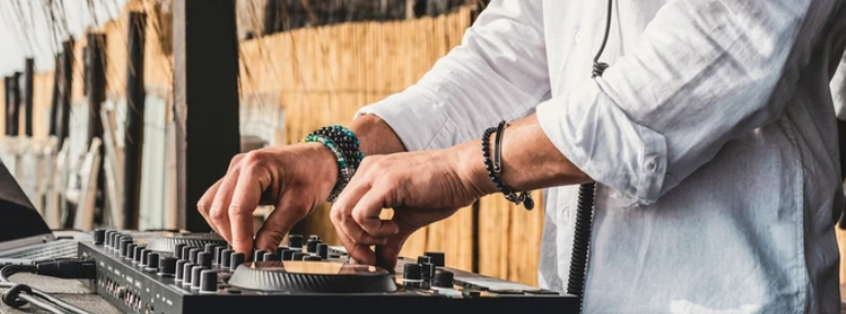 Calgary DJ operating his turntable equipment