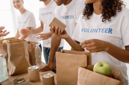 This is a picture of people handing out food at a charity event.