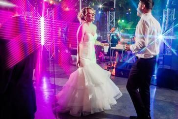 Wedding dance floor with DJ lighting at Calgary event