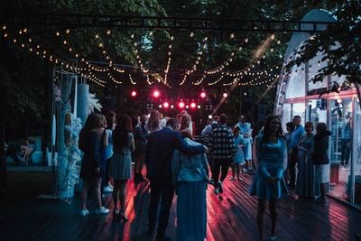 Outdoor evening event with DJ lighting setup in Calgary