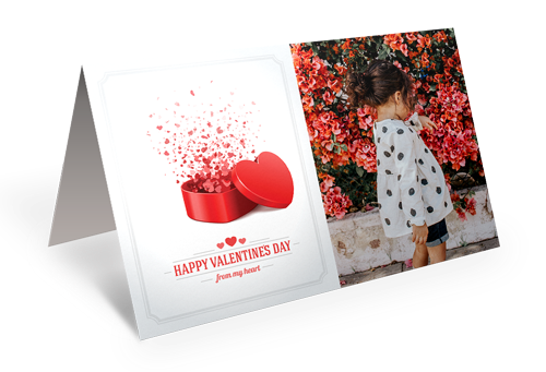 A valentine 's day card with a picture of a little girl and a red heart.